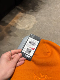 Arcteryx orange embroidered bird beanie