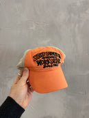 Stussy Workwear orange trucker cap